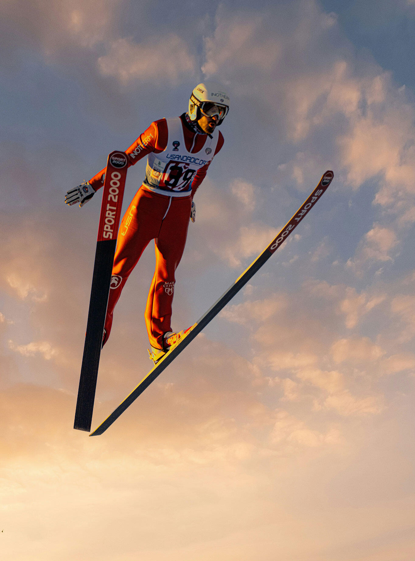 Ski jumper flying through the air — mental clarity and total commitment in a high-risk environment